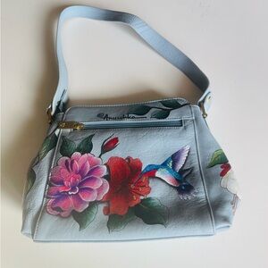Anuschka Sky Blue Bag with Floral and Hummingbird Design